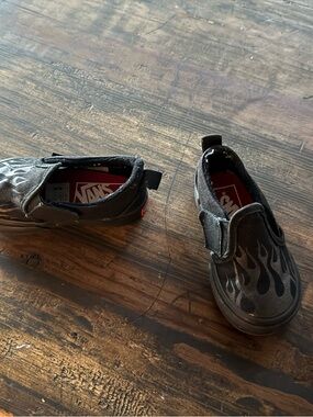 Vans Kids Black Slip-On Sneakers with Flame Design